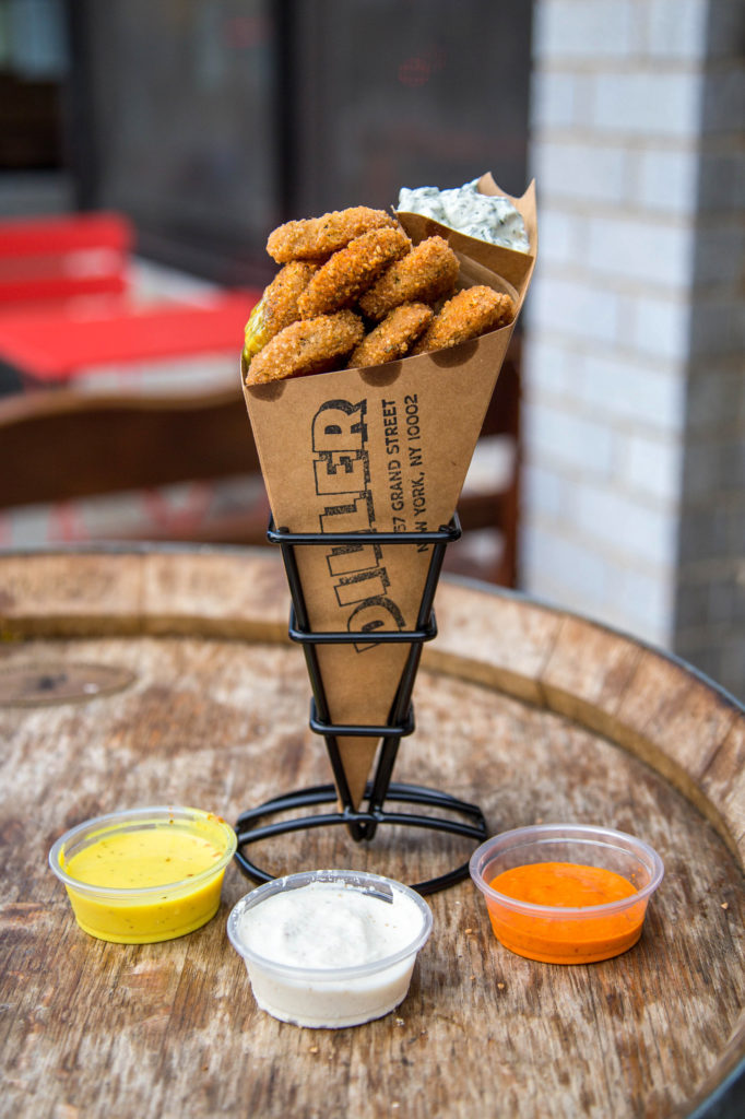 Fried pickles served in a paper cone, with 3 dipping sauces. 