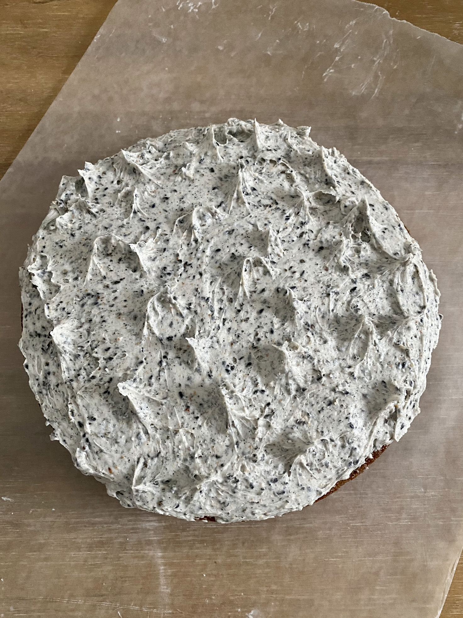 bird's eye view of black sesame cake resting on parchment paper